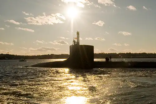 Submarie at sea, submerging near the surface.